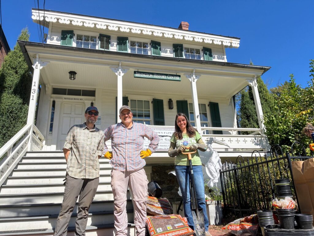 Photo of volunteer gardeners in front of the McVickar house